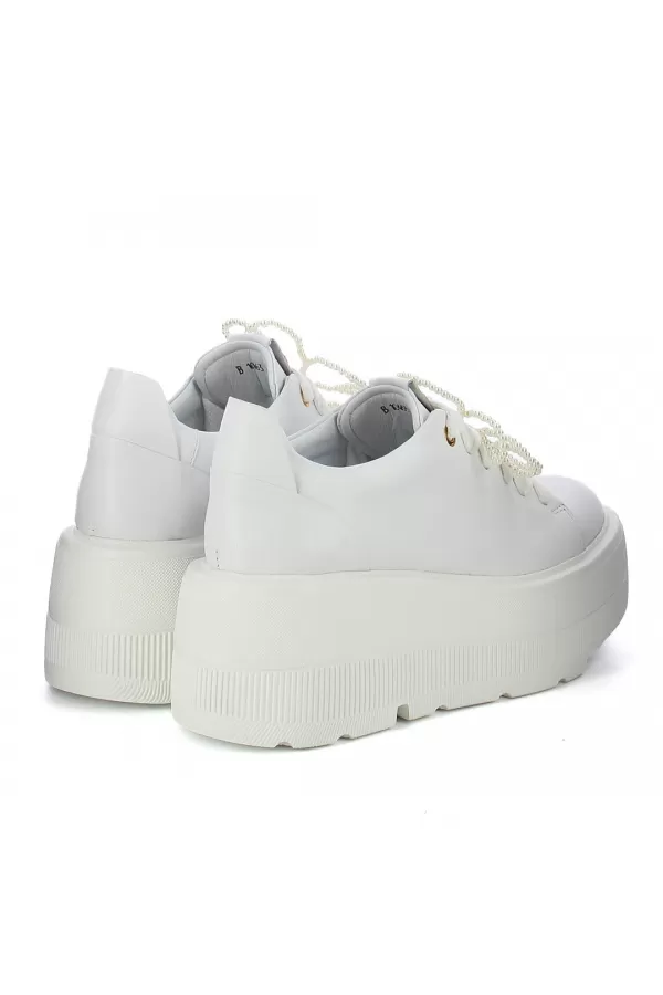 Zobacz Białe sneakersy skórzane CARINII--B10463-L46-000-000-G36