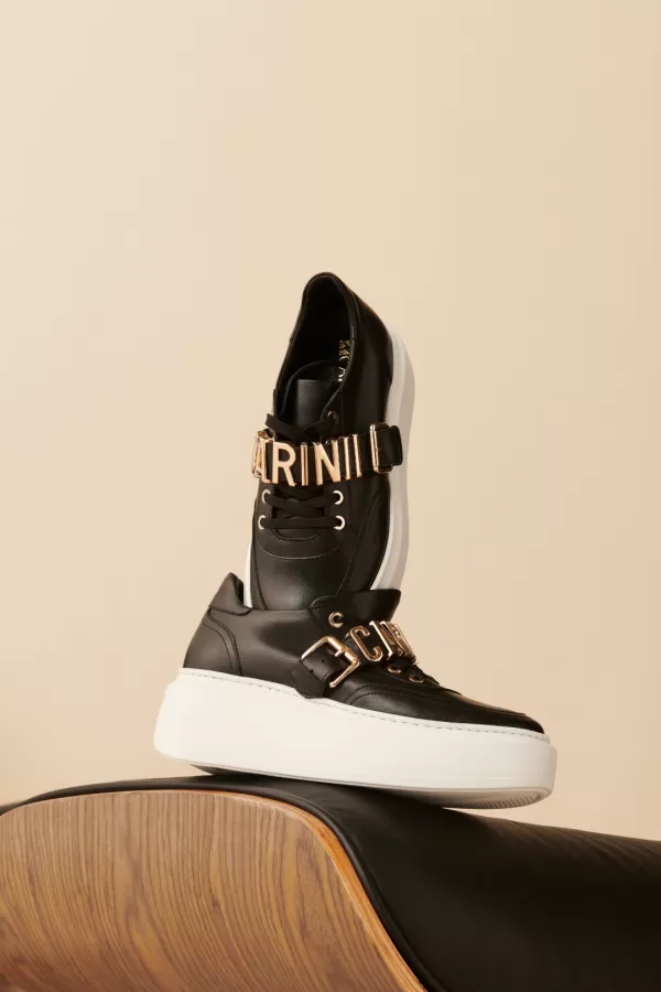 Zobacz Czarne skórzane sneakersy damskie CARINII--B9075Z-E50-000-000-F75